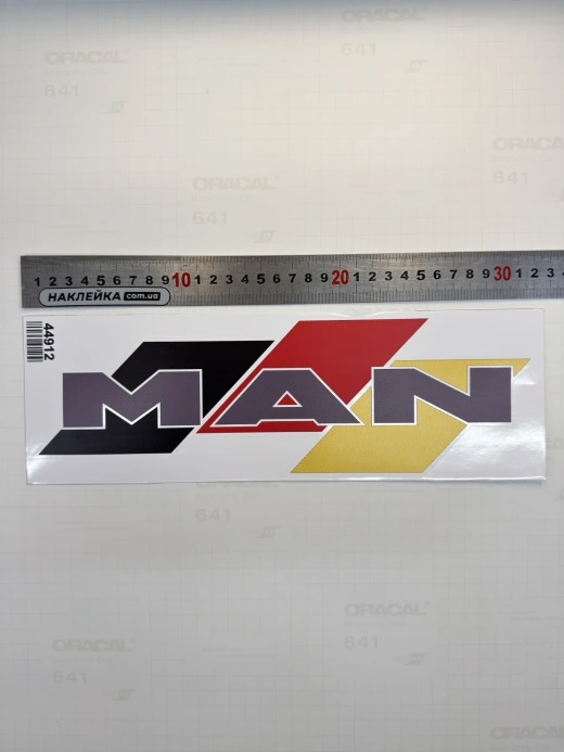 Наклейка виниловая MAN на флаге (32х10 см) цветной